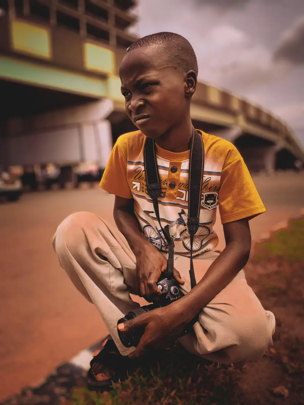 boy posing with a camera