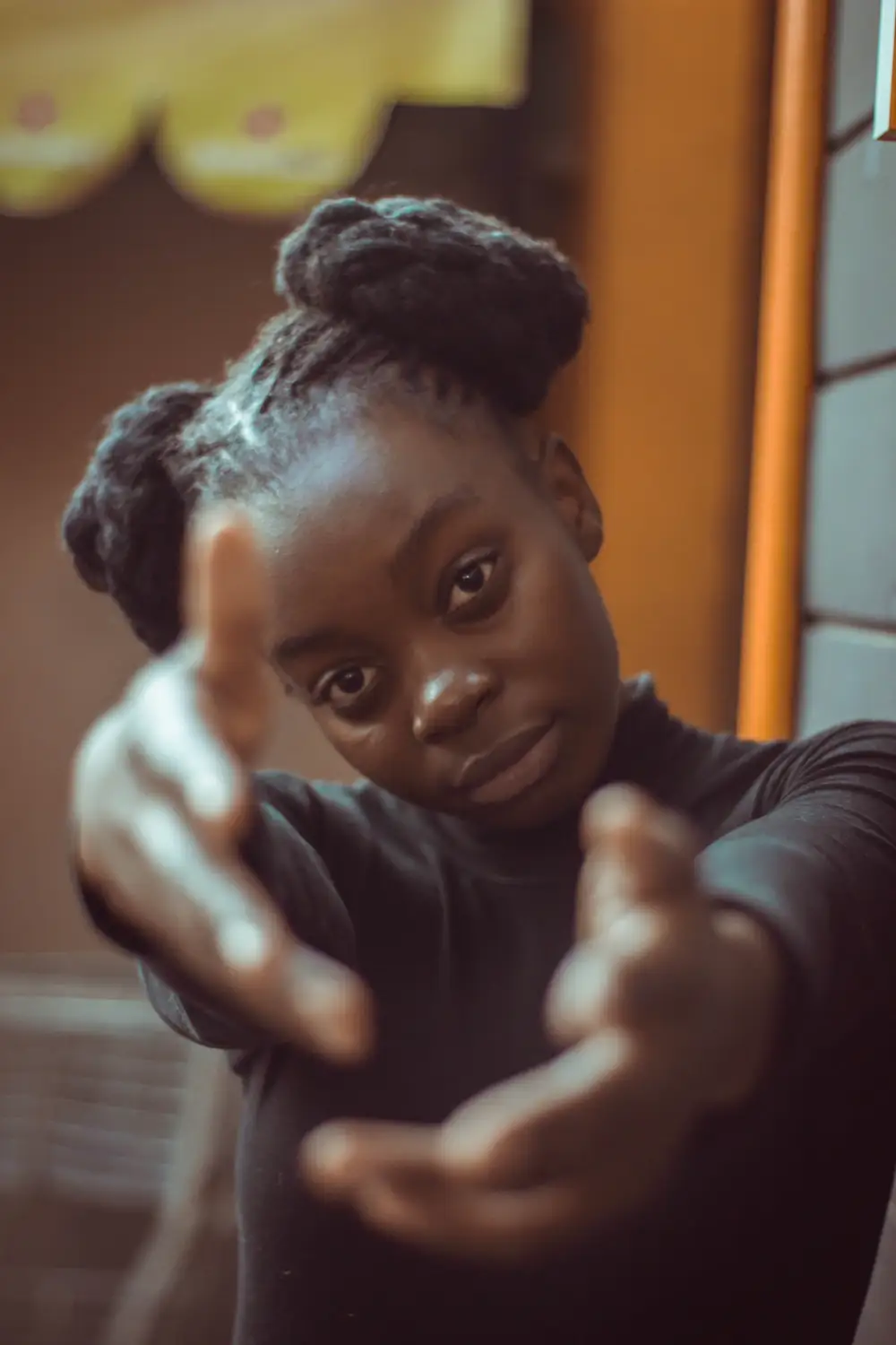 black girl pointing at camera