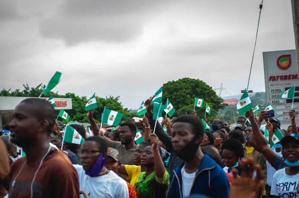 men with nigerian flag