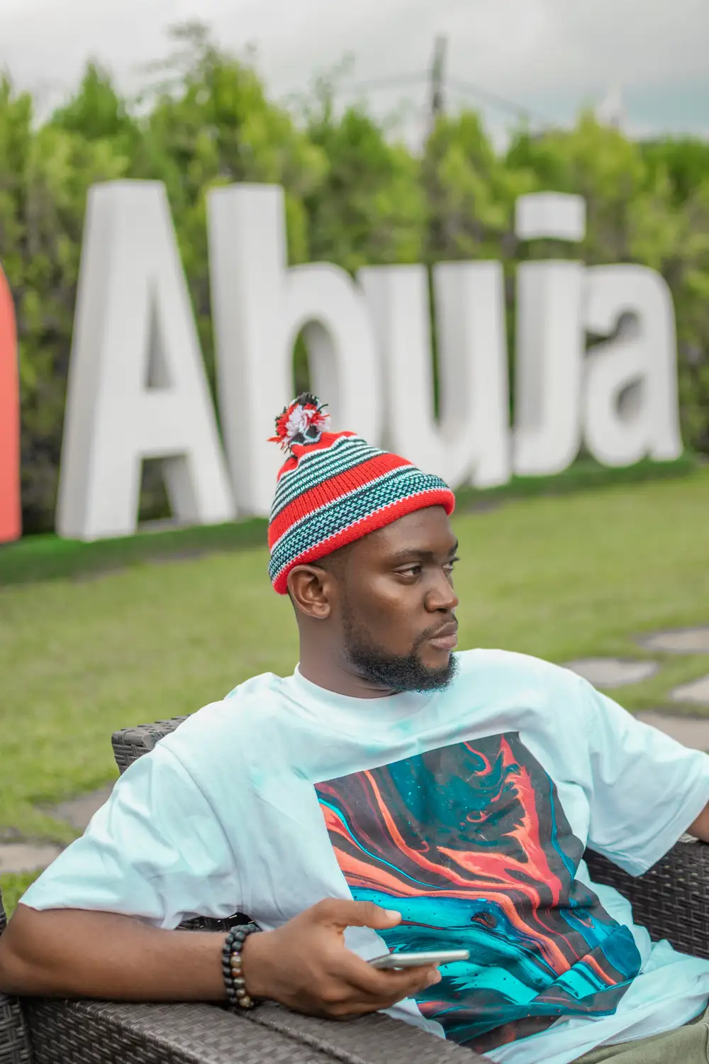 Man wearing an Igbo cap