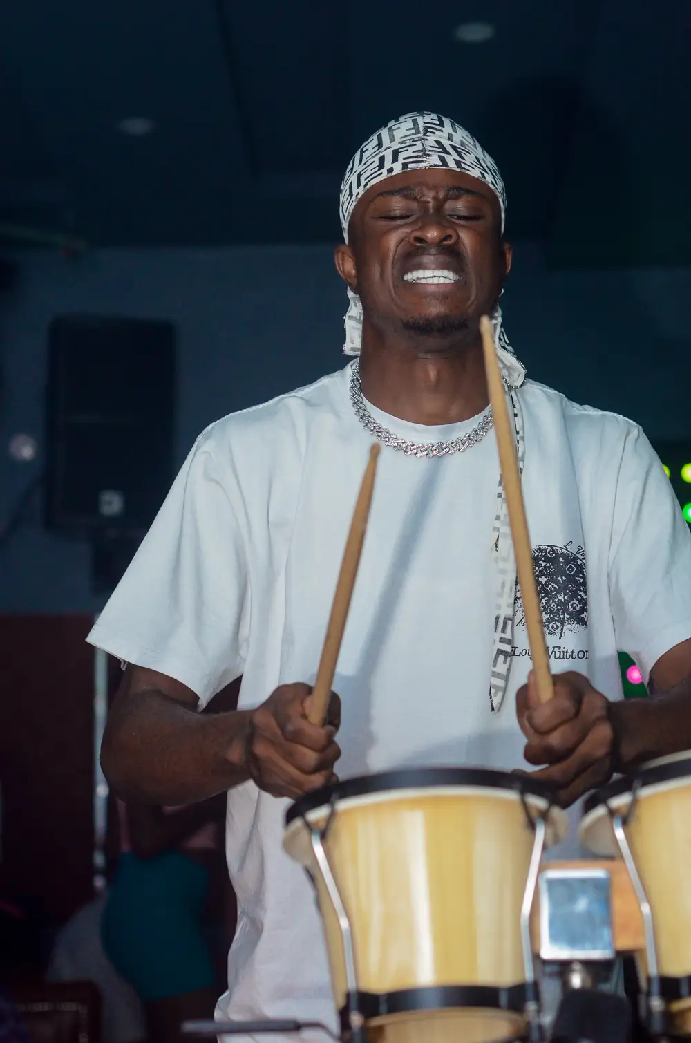 Guy holding drumsticks