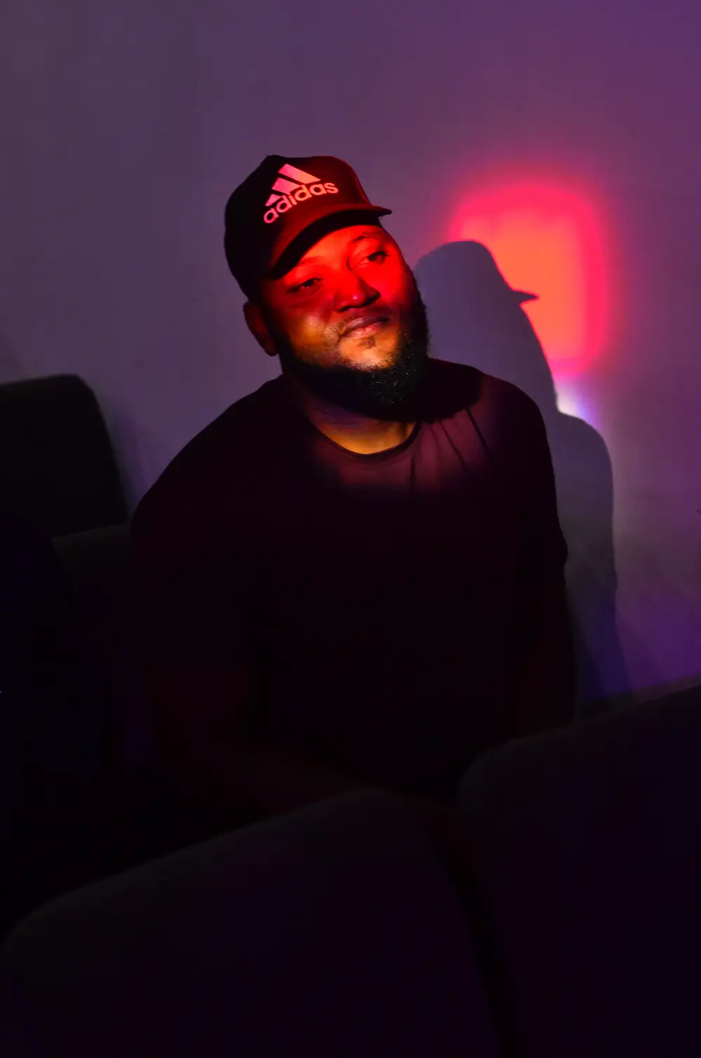 Guy wearing an adidas cap