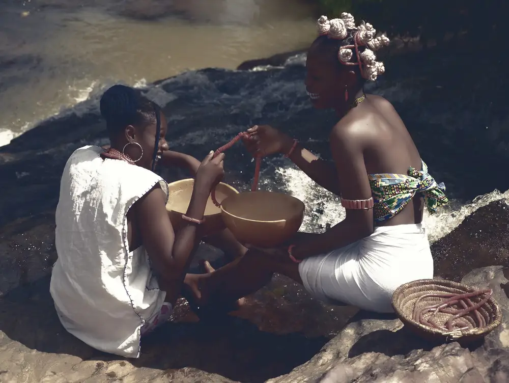 Girls holding calabash