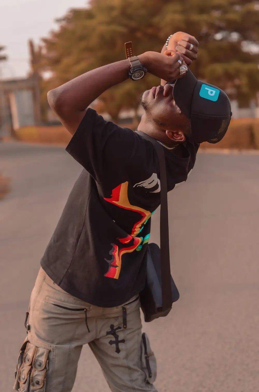 Guy holding a cross bag