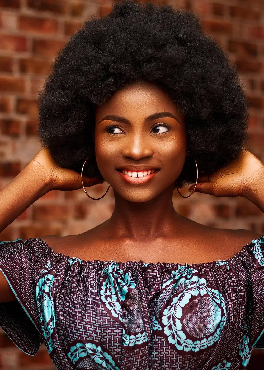 Smiling black lady on afro wig