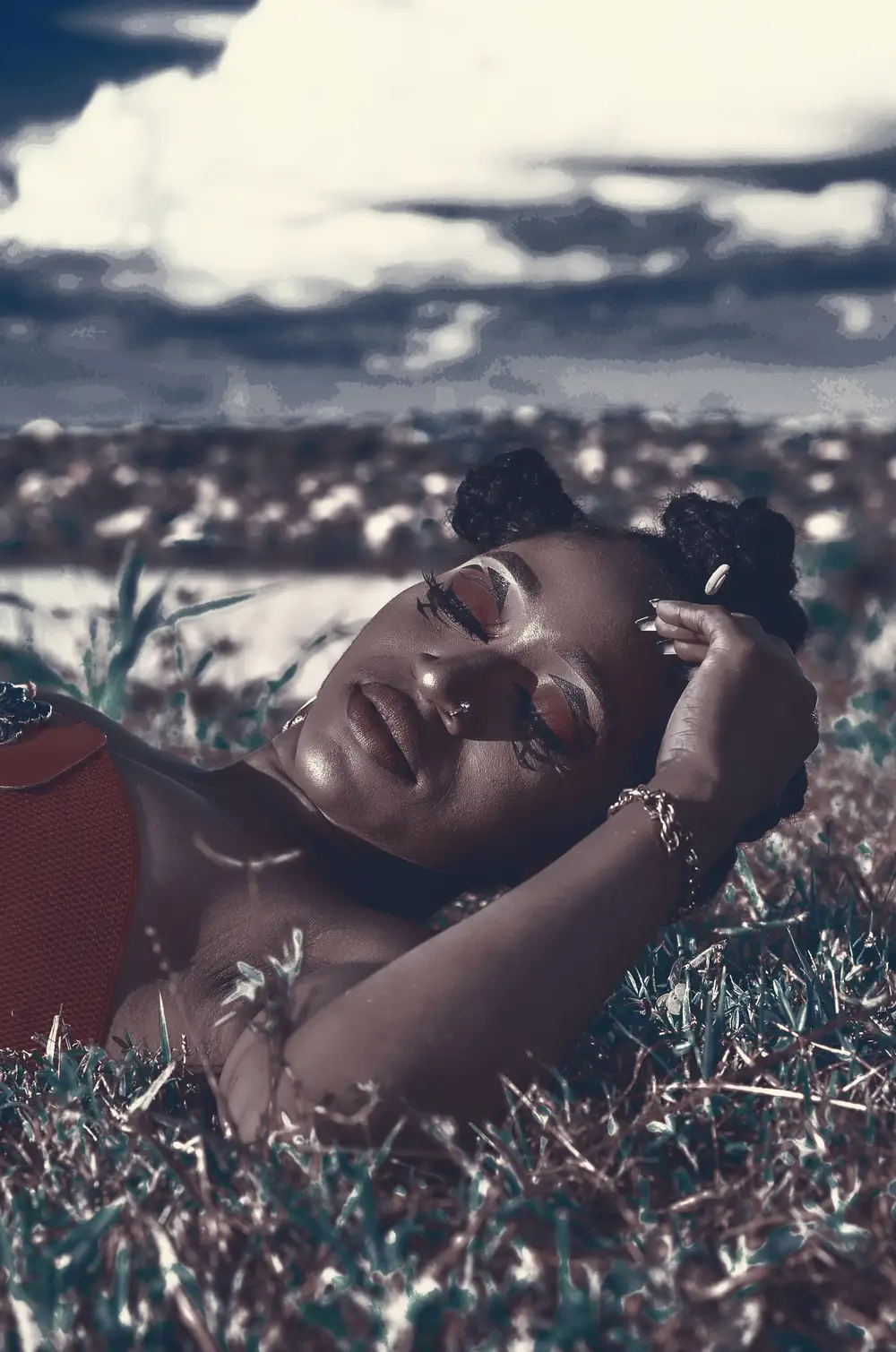 African girl lying on grass