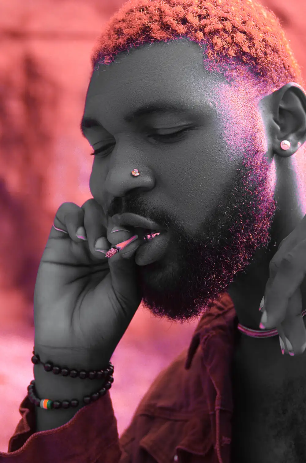 Handsome guy with earring smoking