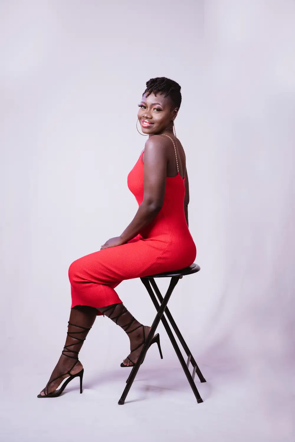 woman posing on chair