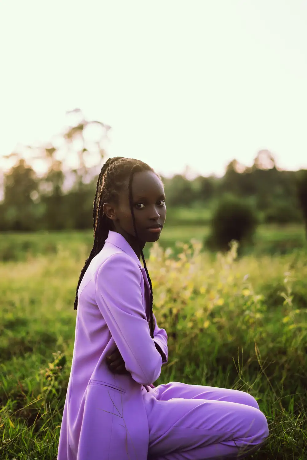 Girl in purple folding her hands