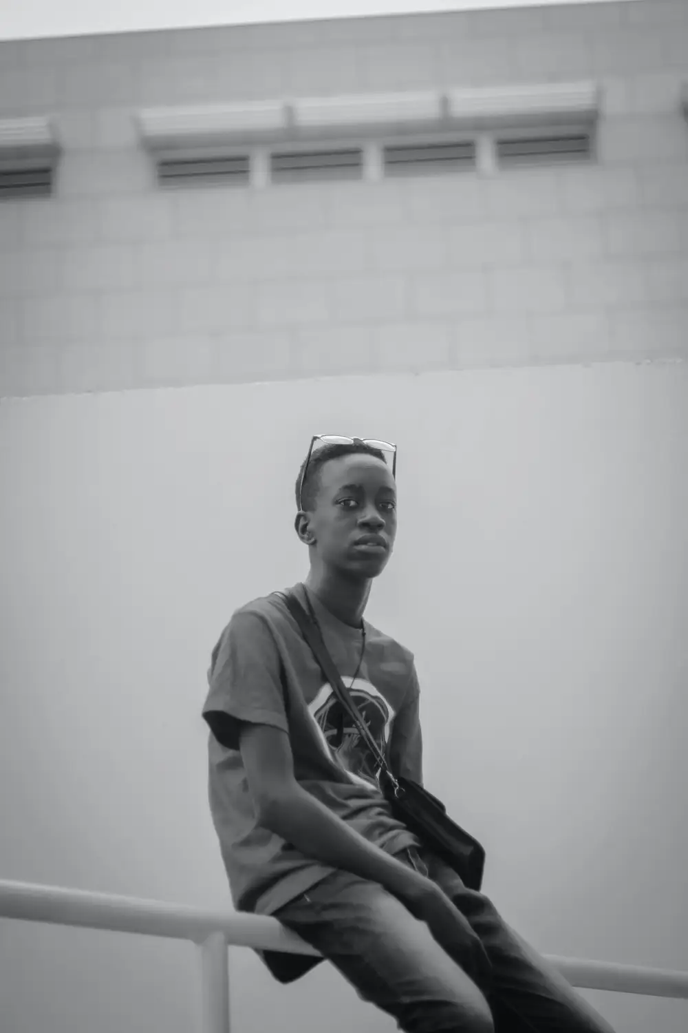 Boy carrying a cross bag