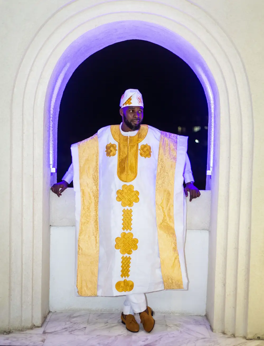 Groom by the lit hallway