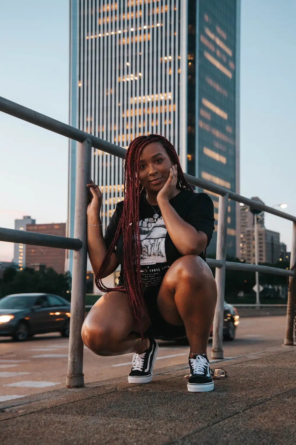 Young woman squatting and posing for picture