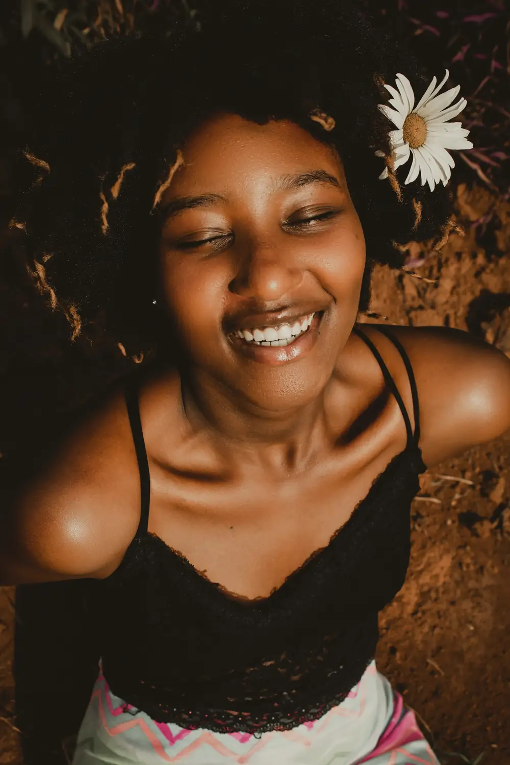 Smiling pretty Lady with flower on her hair