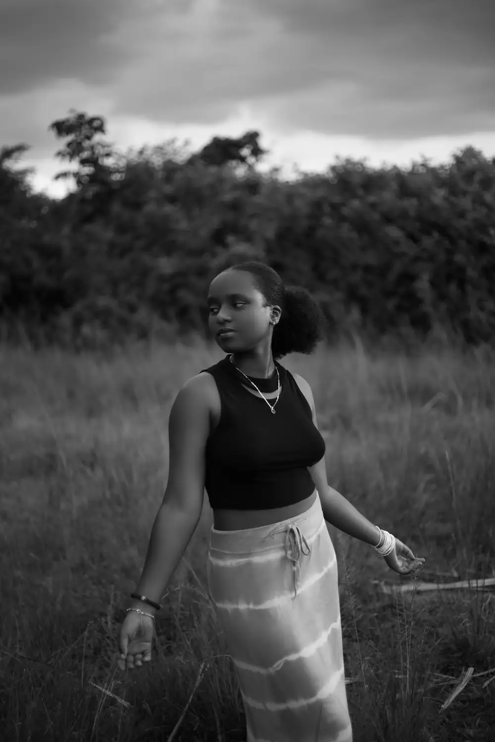 Lady on black top in the field