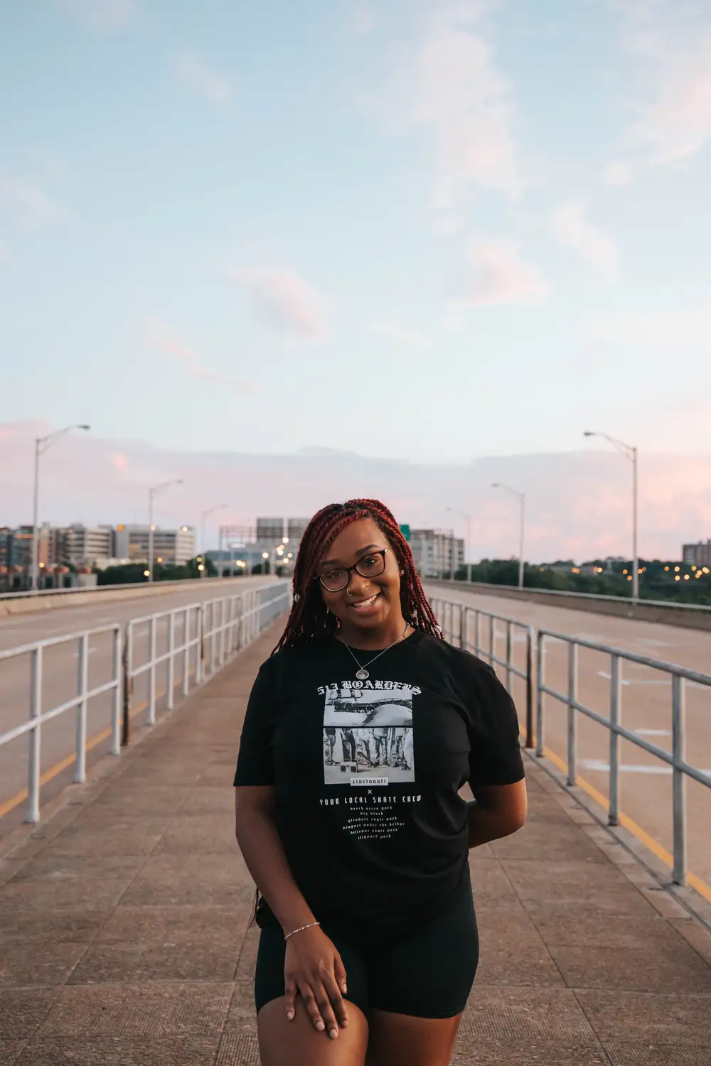 young lady wearing a black shirt smiling