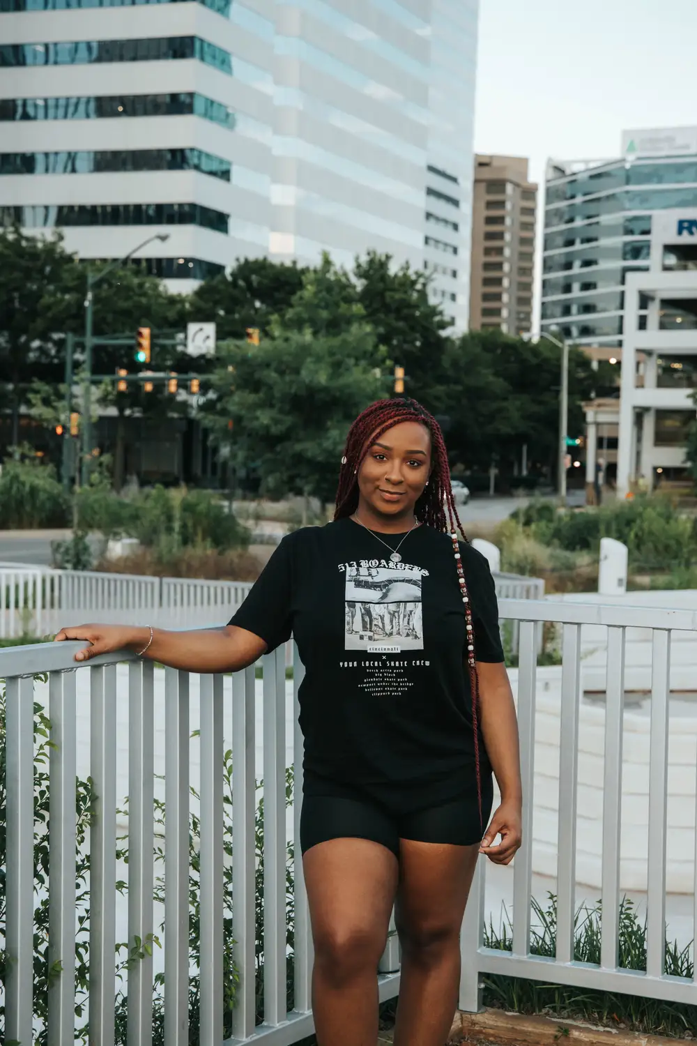 Young woman on braids wearing shirts and shorts