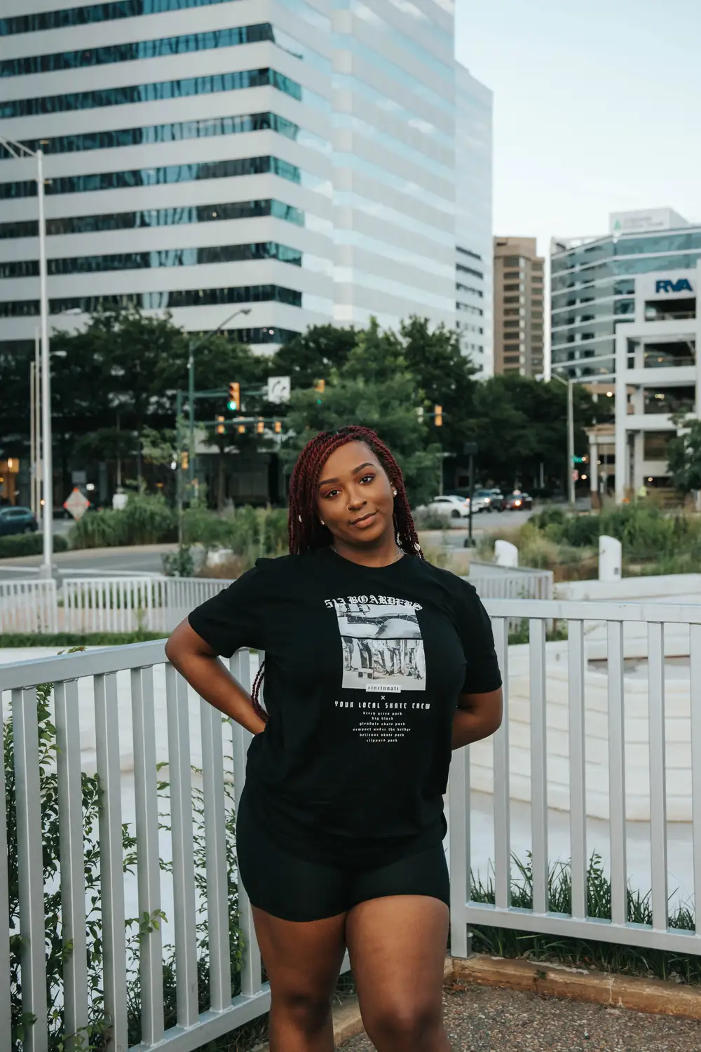 Young woman wearing a black shirt and shorts