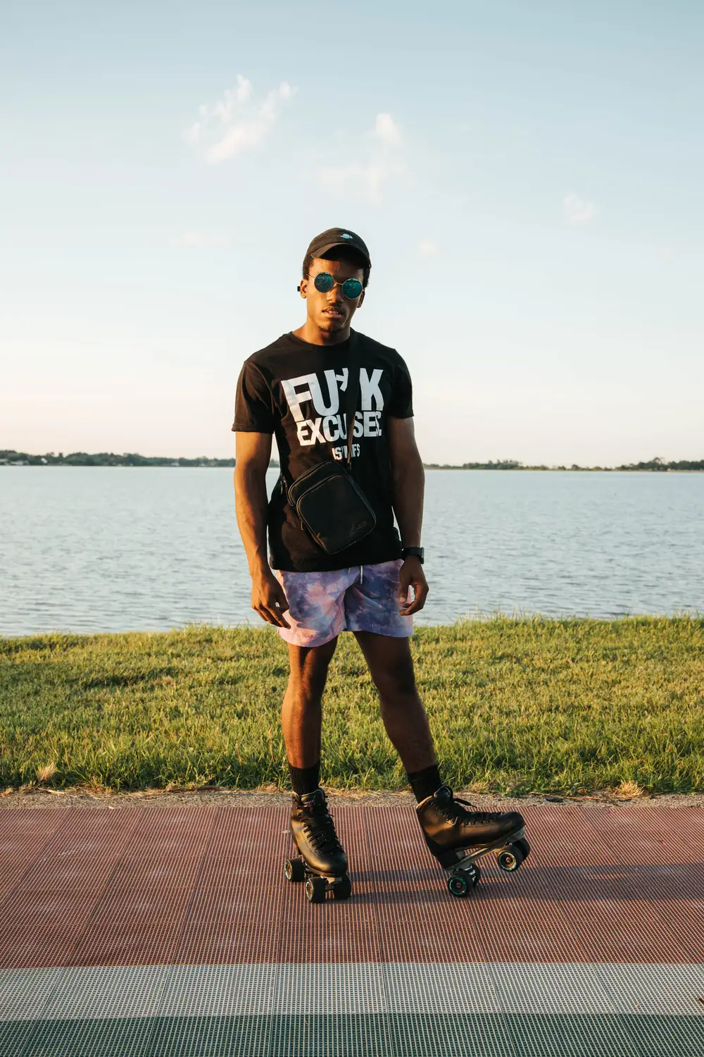 Young man with a rollerskating shoe and a side bag