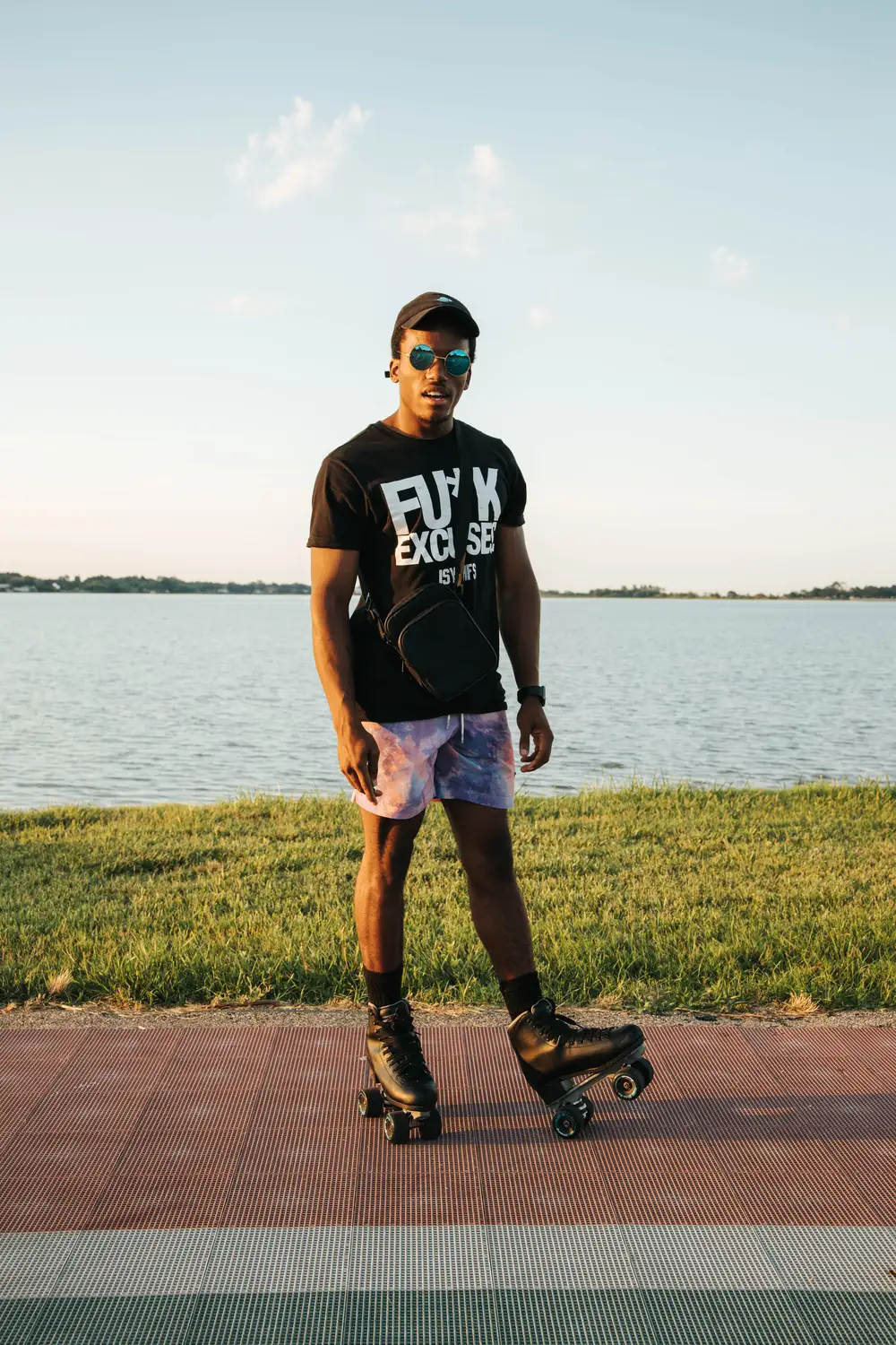 Young man wearing a rollerskater posing for a picture