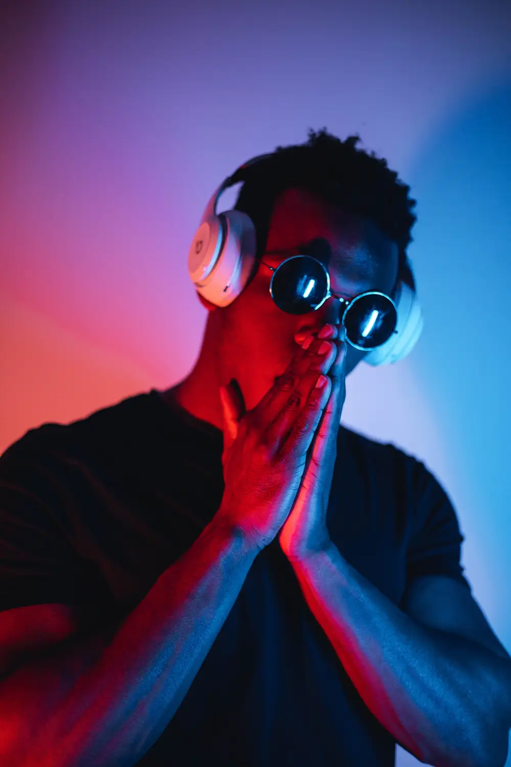 Young man with dark shade and headphone