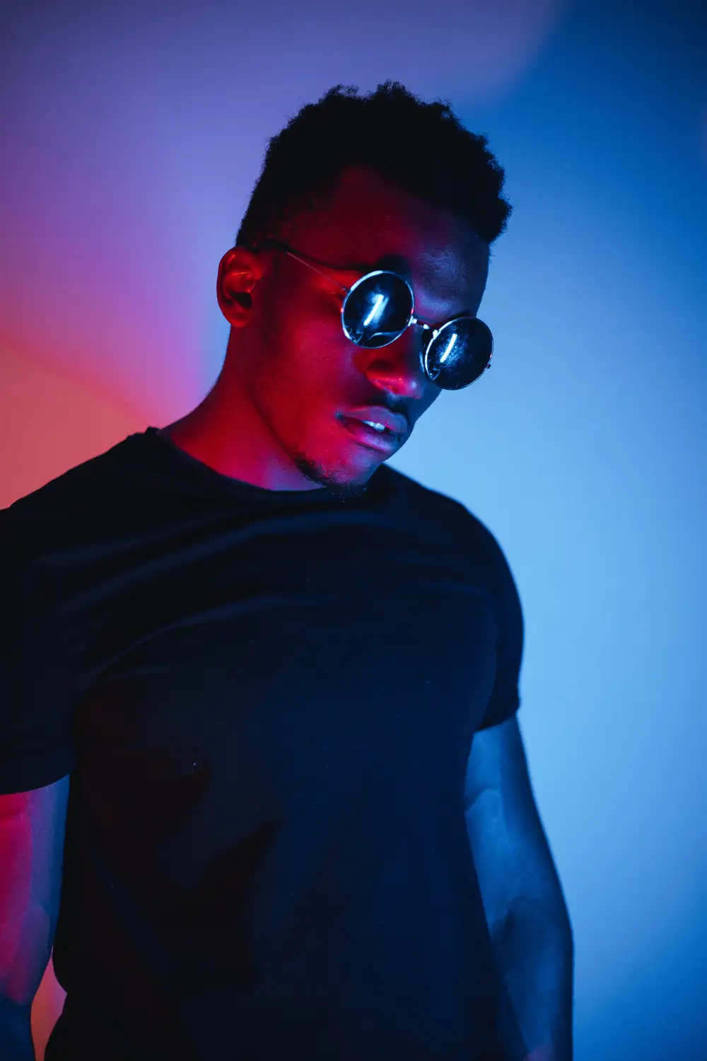 Young man wearing black shirt and dark shades