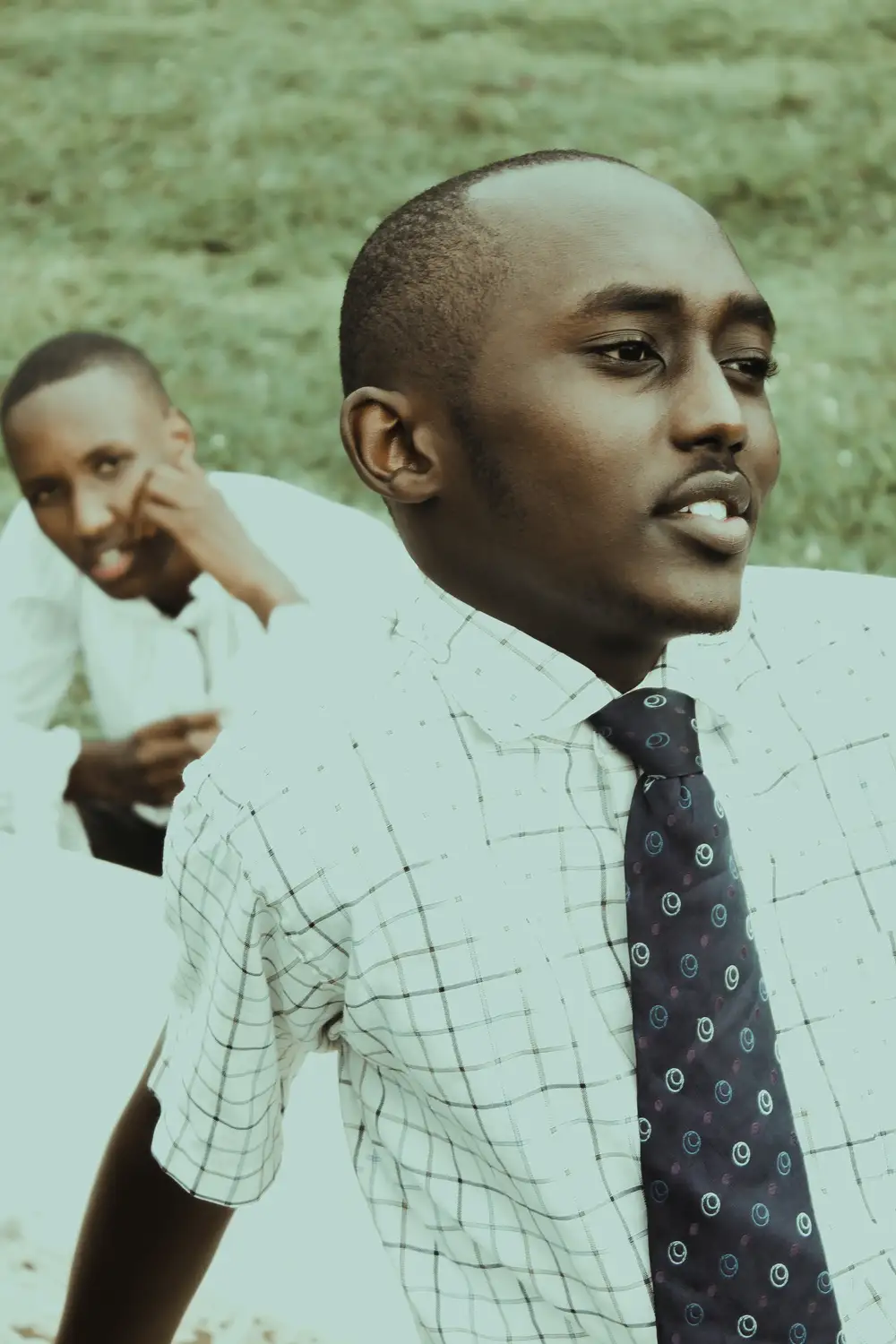 Two Black boys on  strip shirt