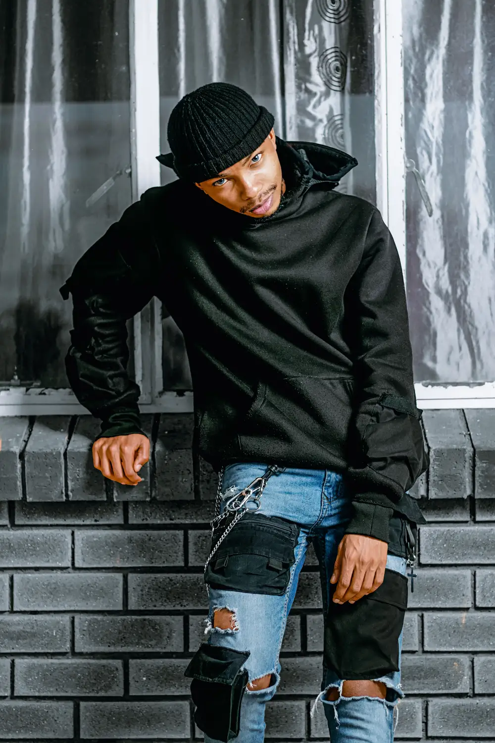 model in black hoodie
