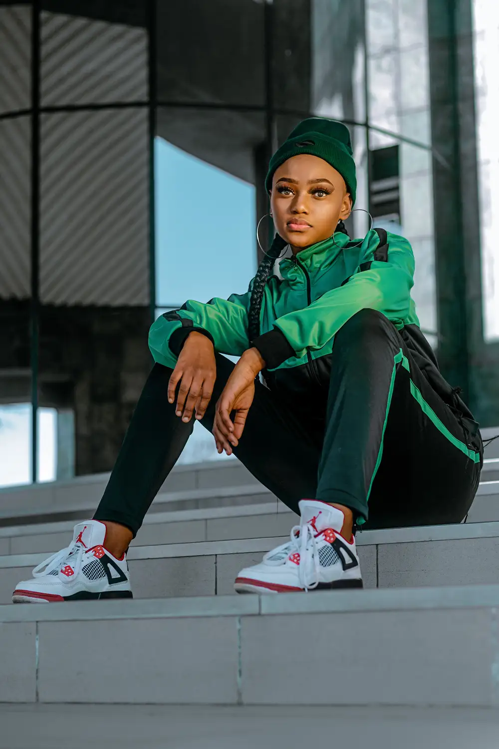 young girl in a green coloured tracksuit