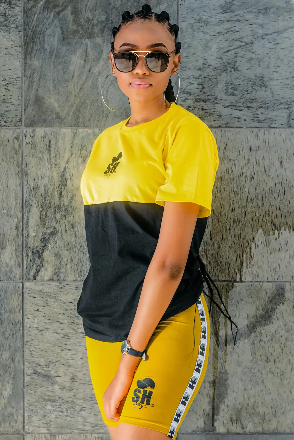 young woman on a yellow and black shirt