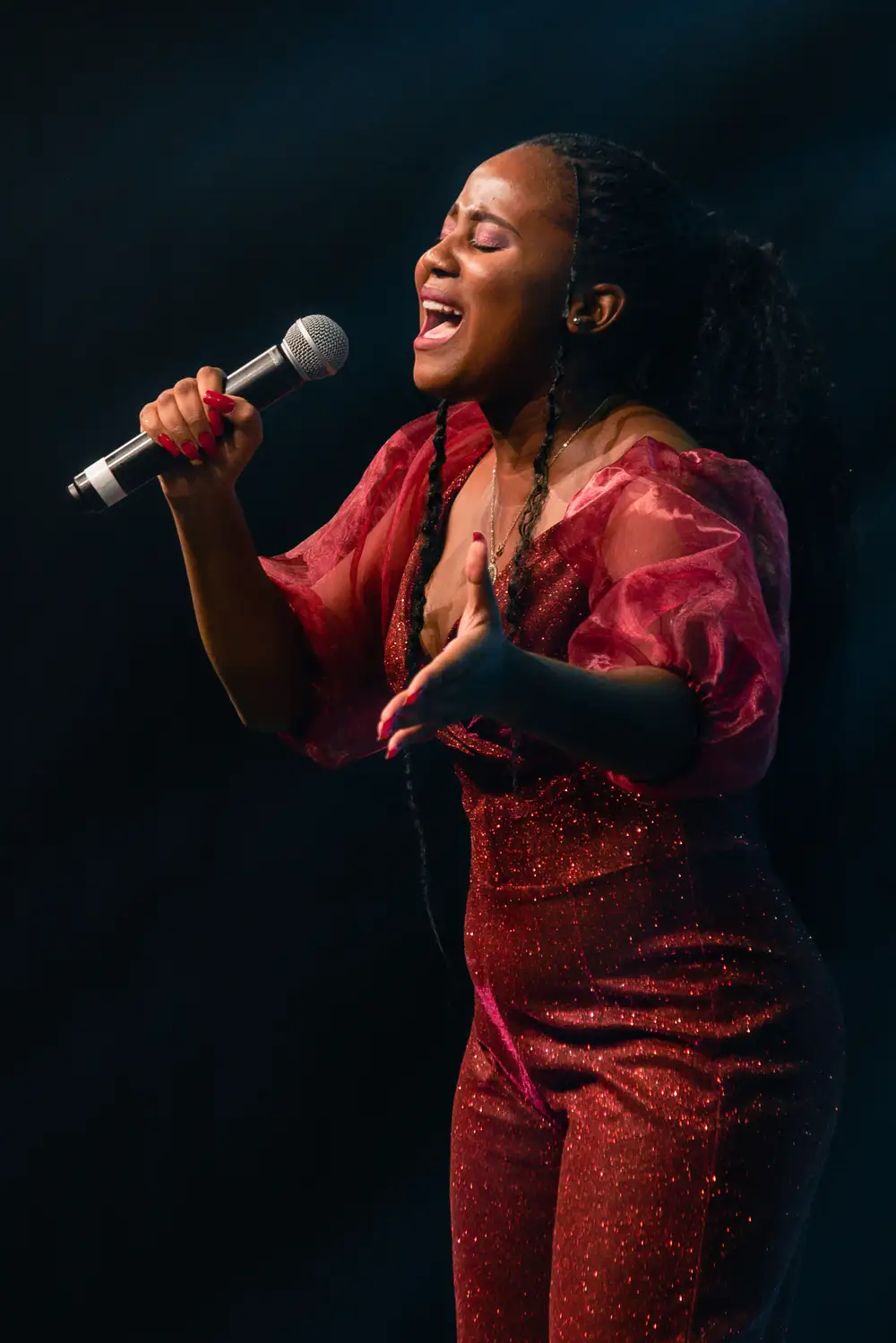 woman in red singing