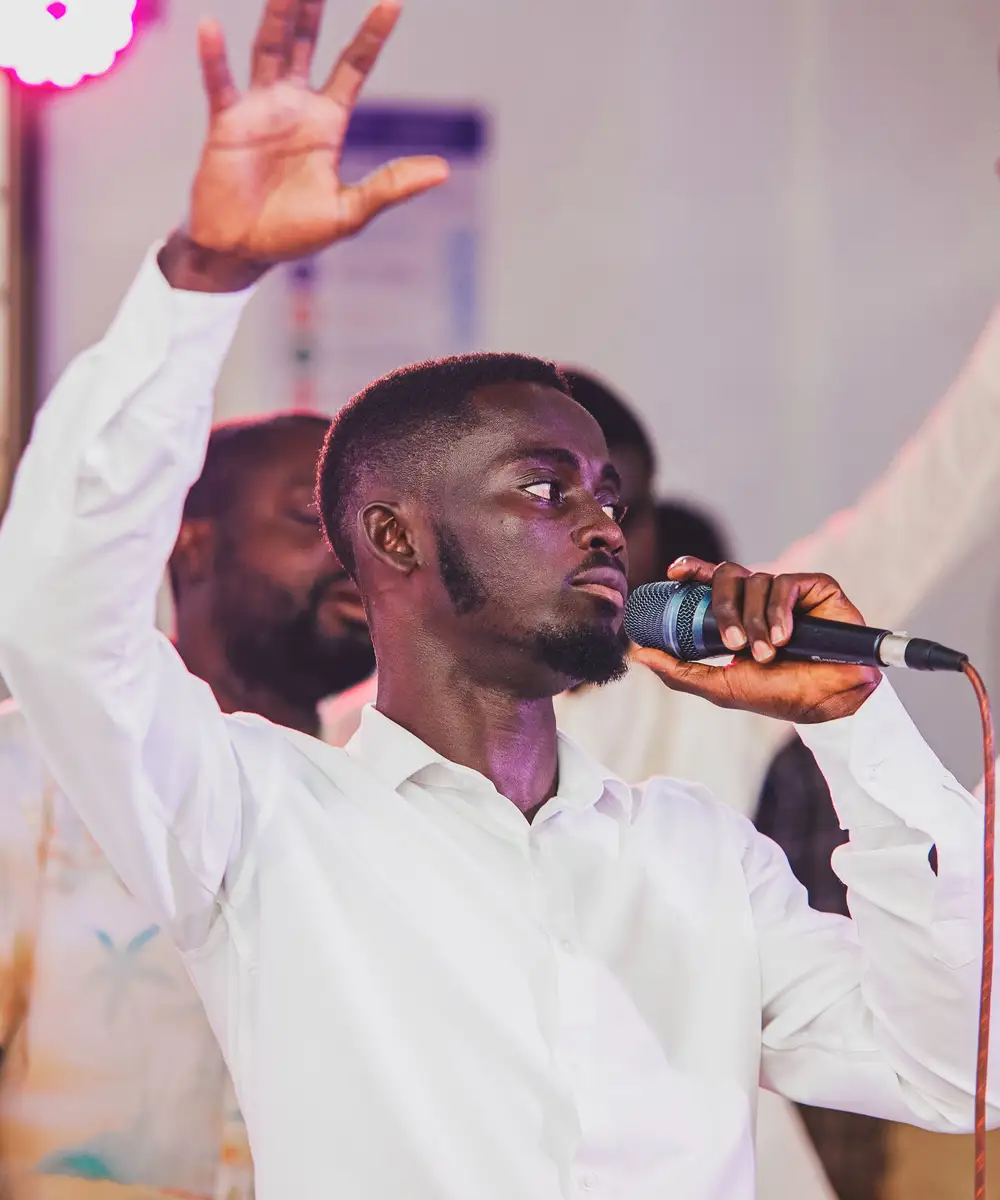 Man lifting his hands in praise