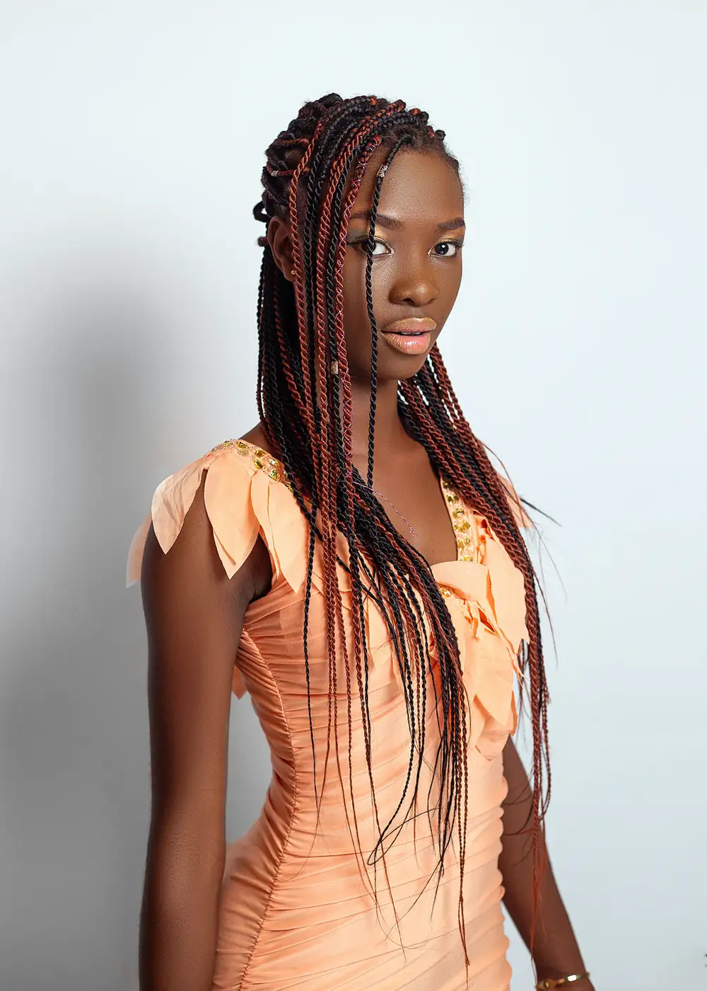 Dark girl with long braids