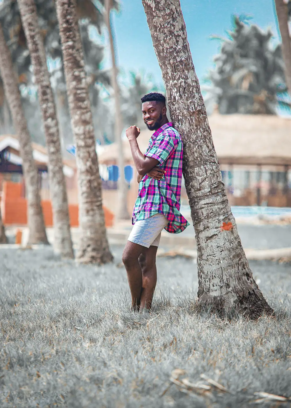 Guy resting on a tree