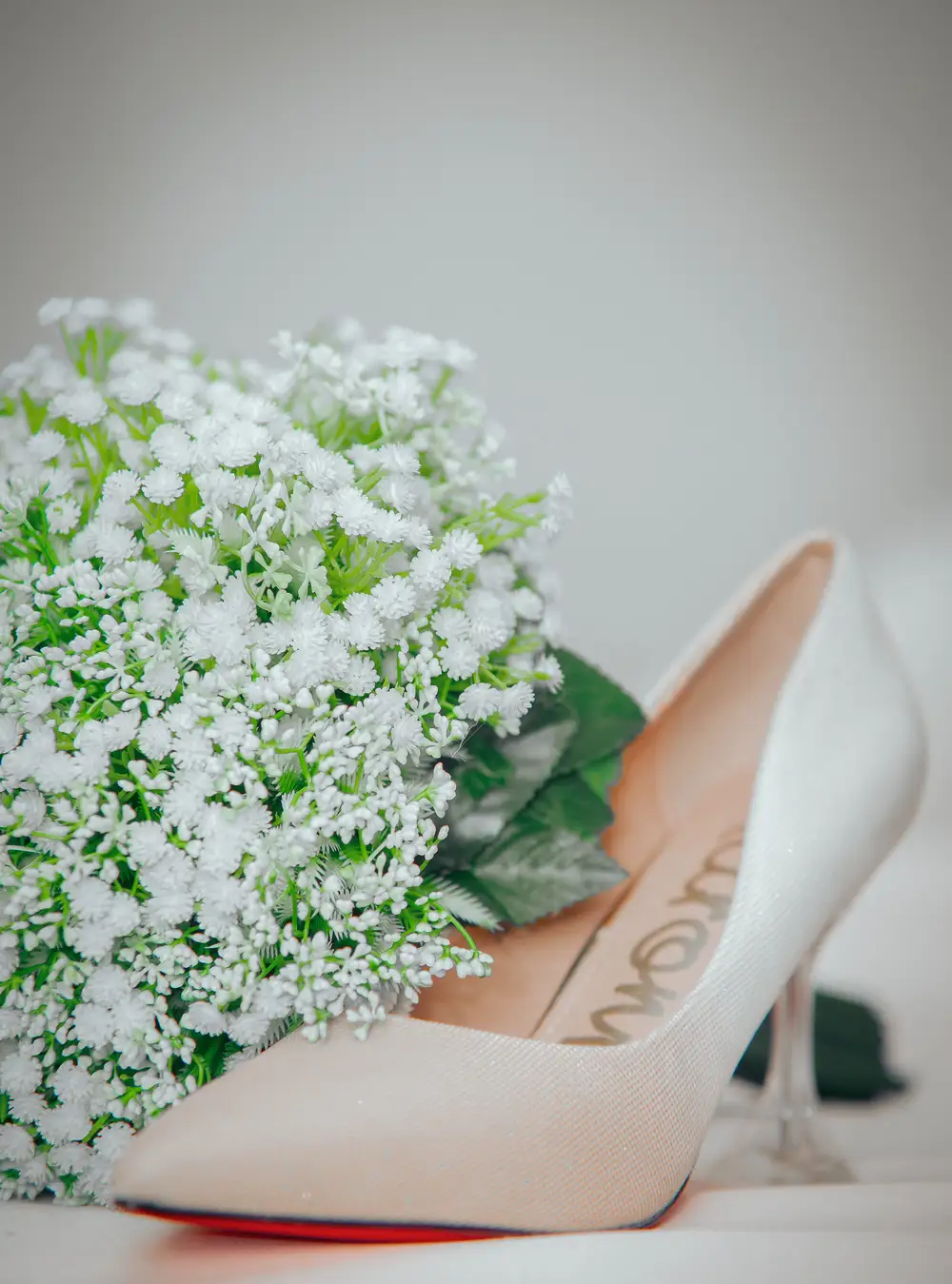 Shoe beside a flower