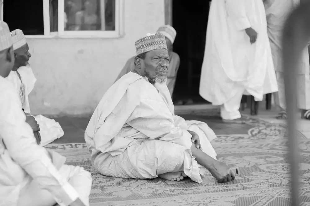 Man sitting on a mat