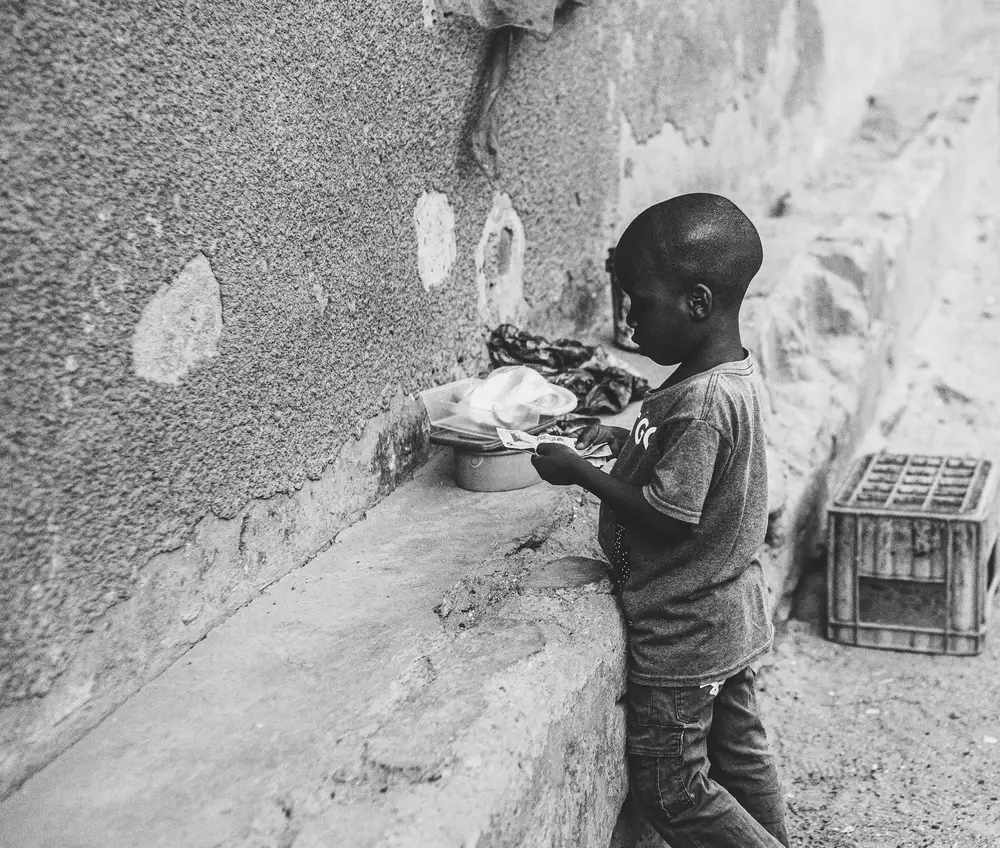 Little boy holding money