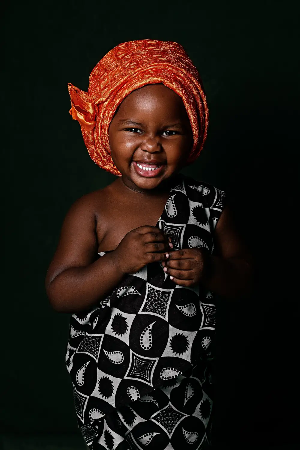 Happy african dark skin female child