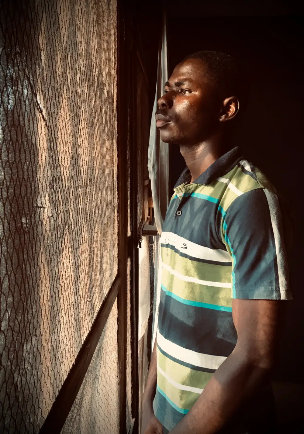 Boy looking outside