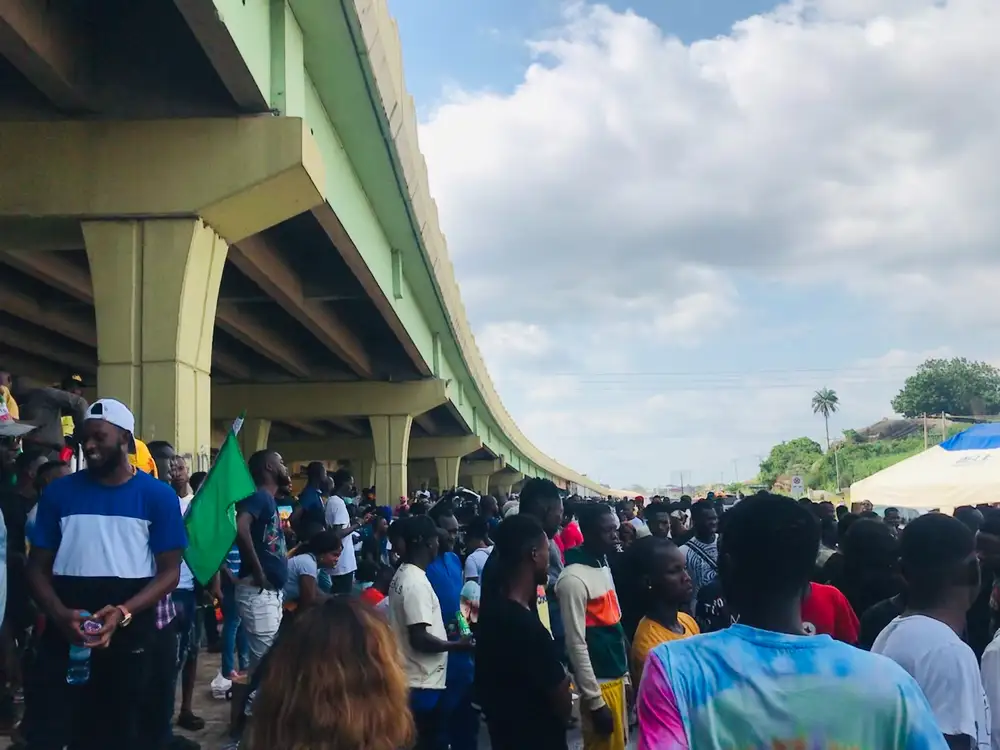 Protesters under a bridge