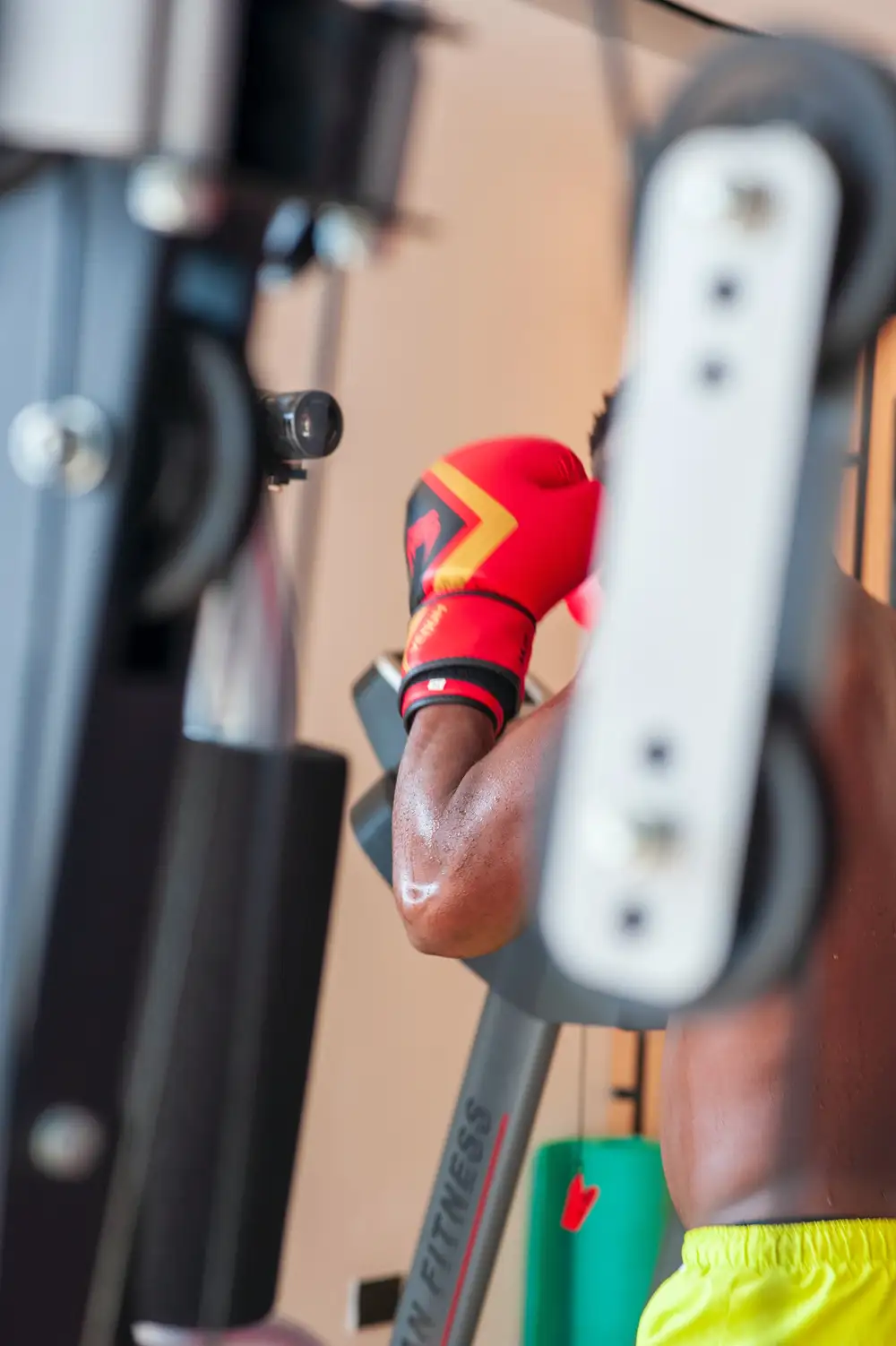 Person with boxing gloves in the gym