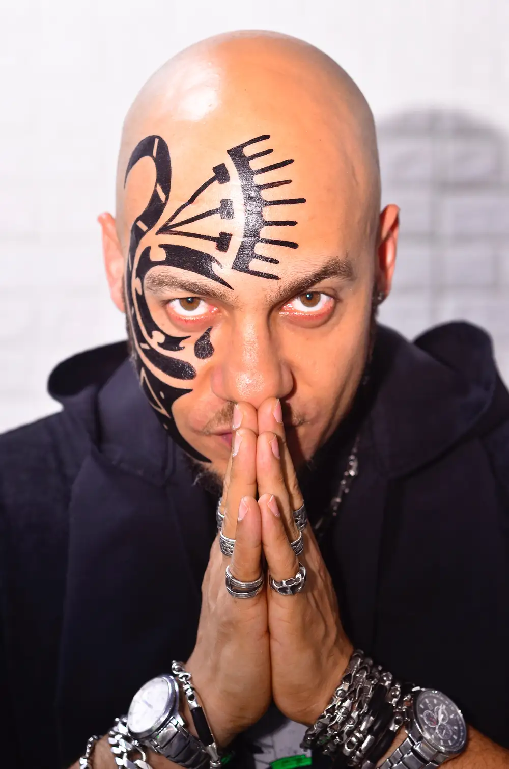 man with tattoo on his face