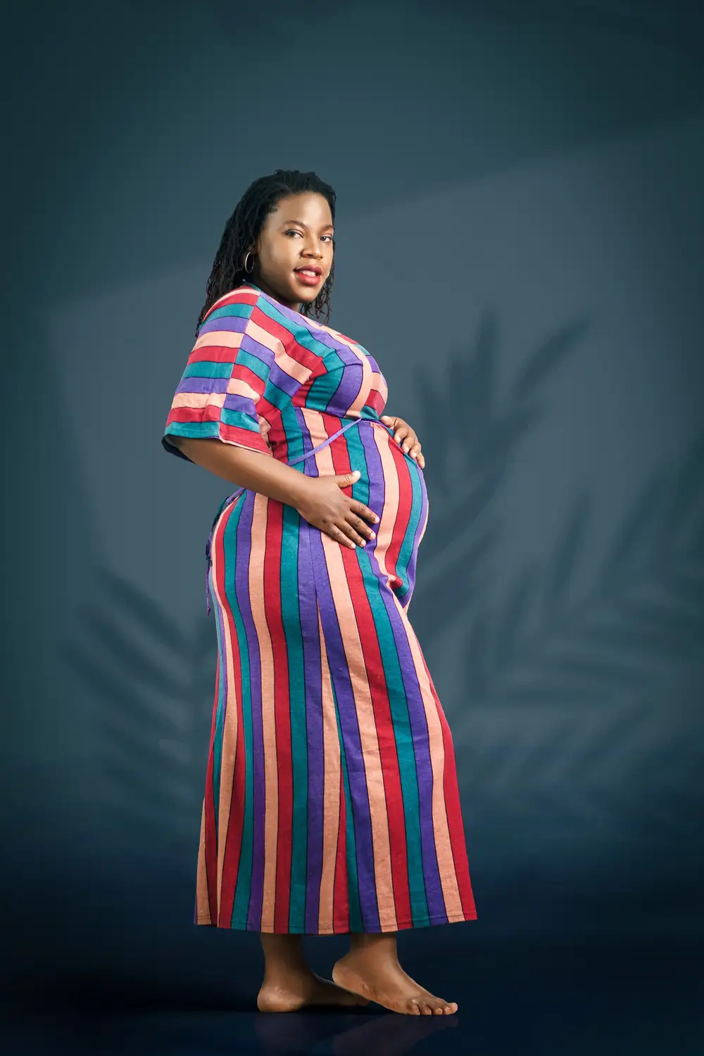 Pregnant woman in multicolor gown