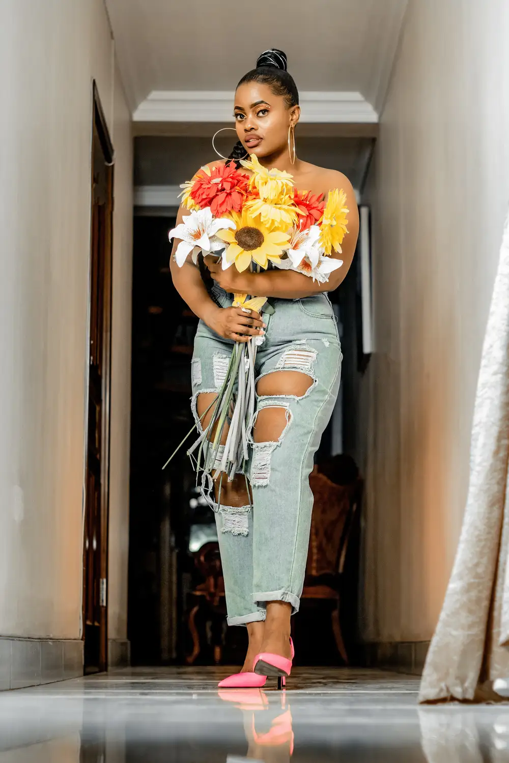 Fine lady hugging flowers