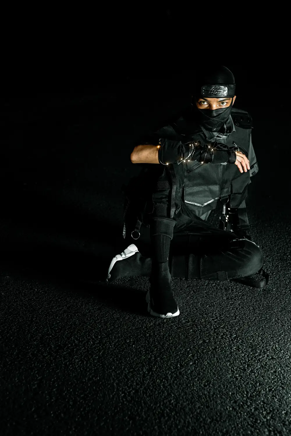 Ninja in black sitting down