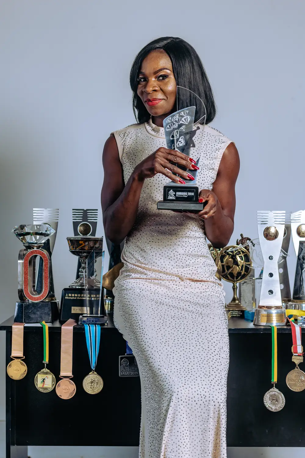 Lady raising her trophy