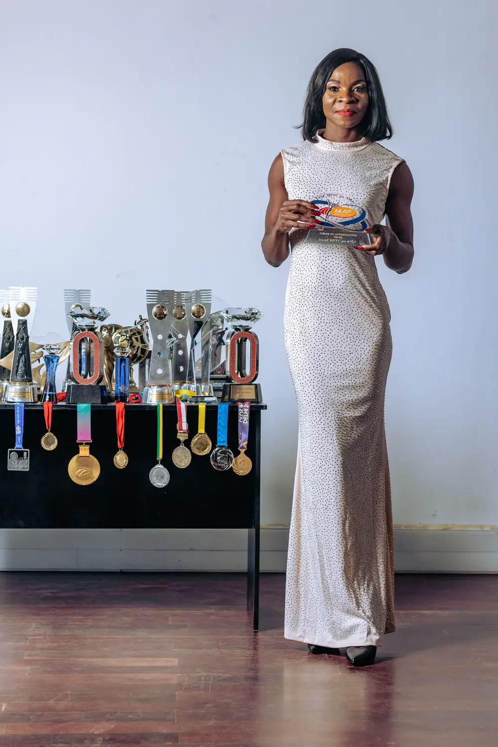 Lady in gown with her awards