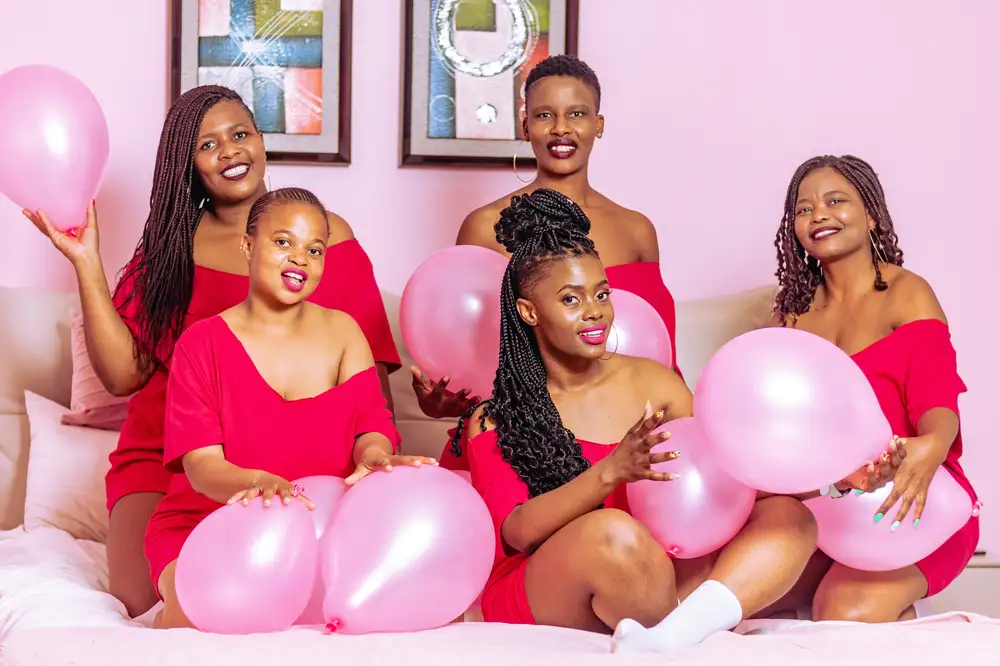 Ladies holding a balloons