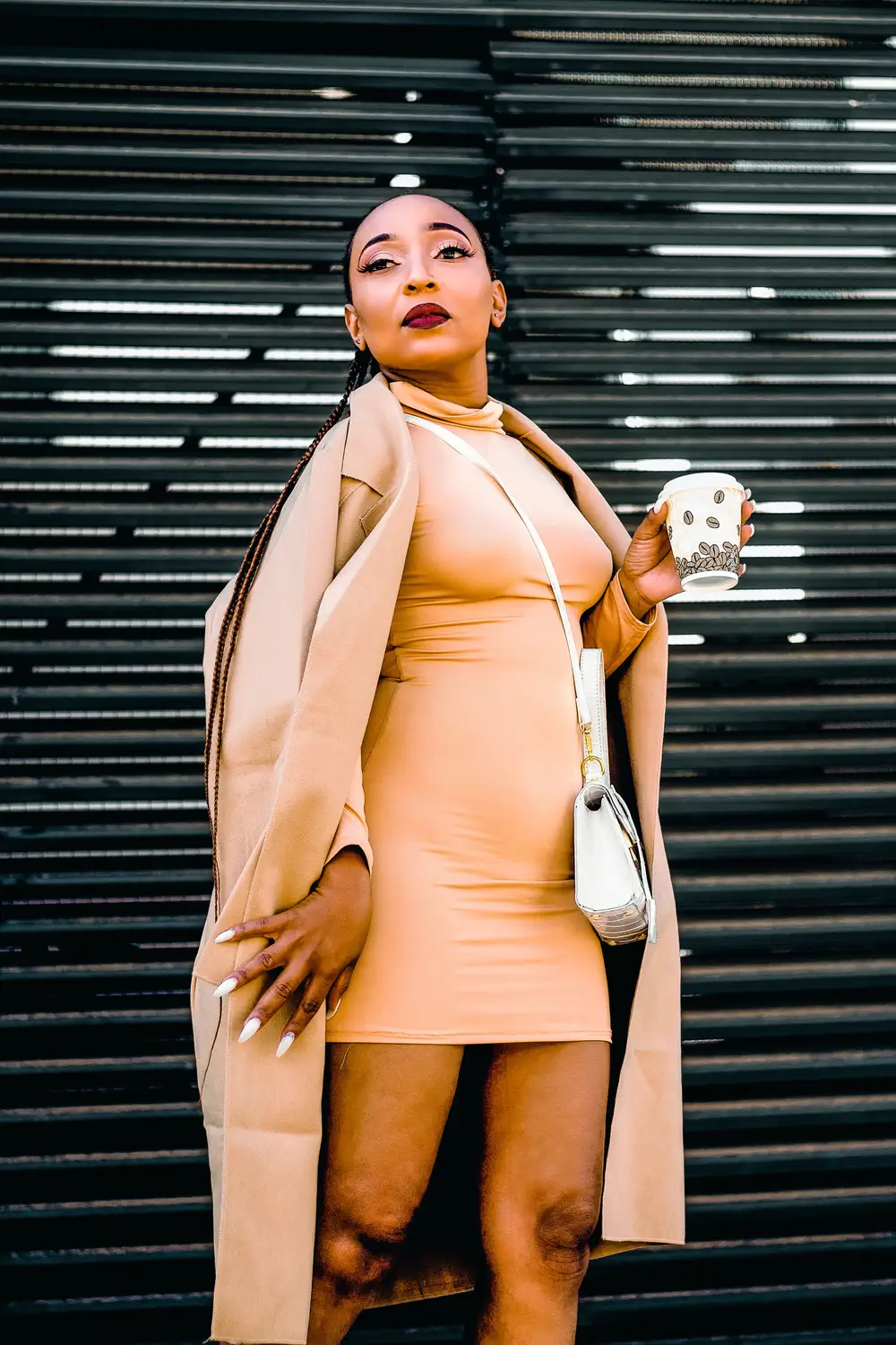 Lady holding a white disposable cup