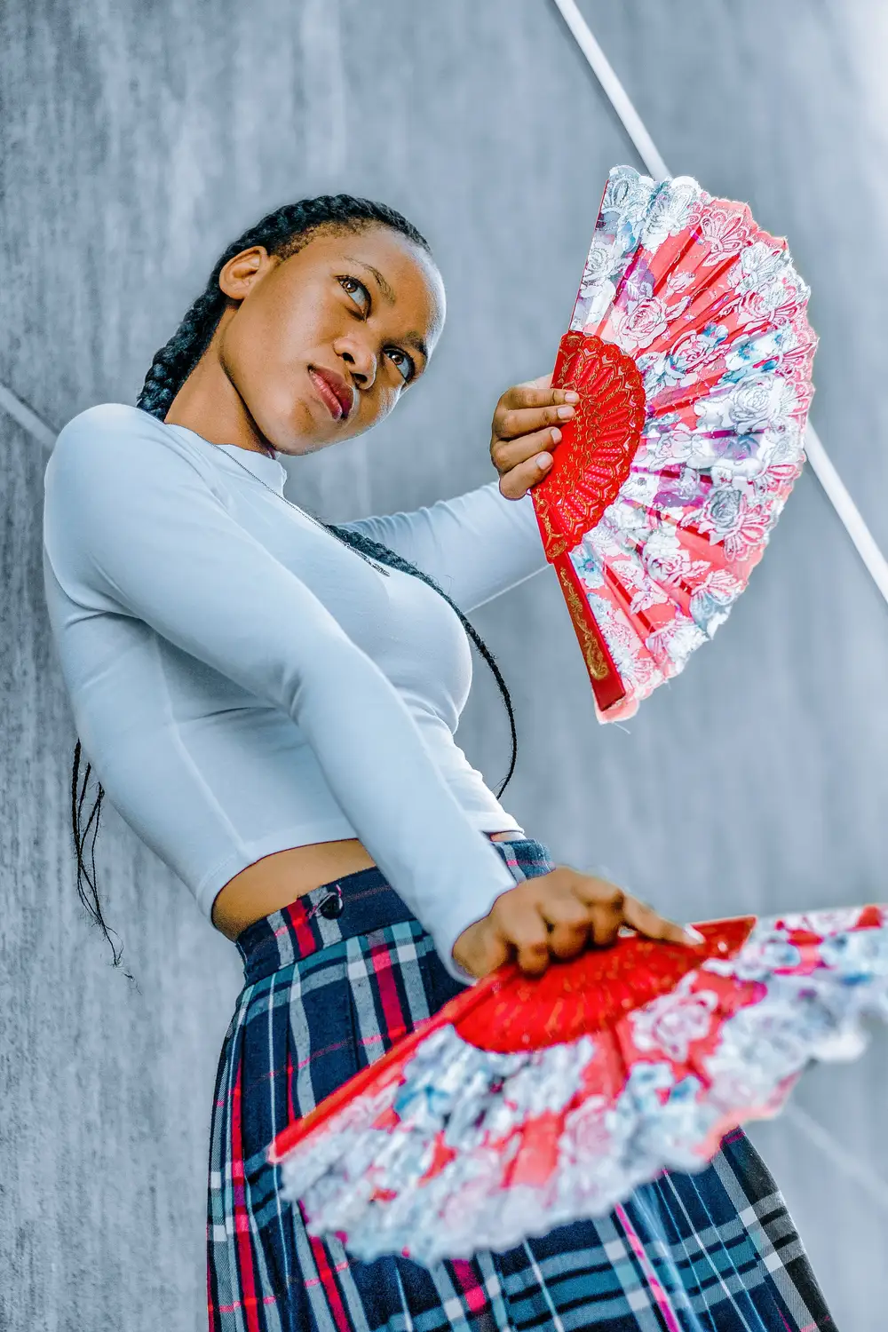Girl holding red fans