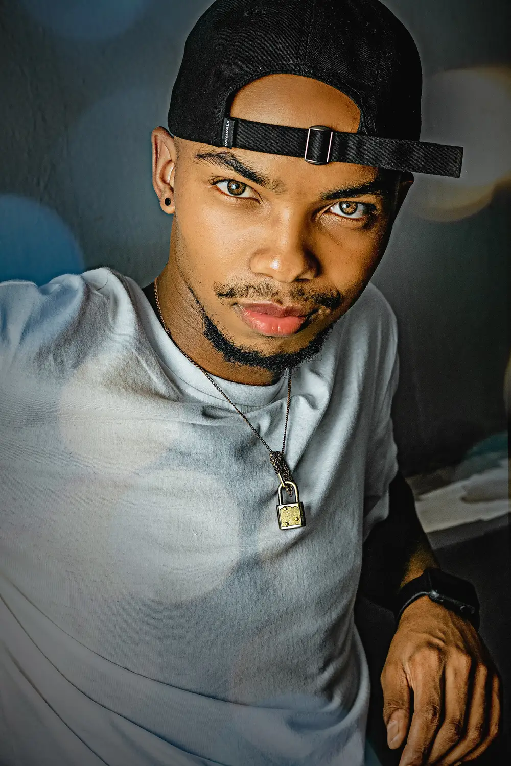 Handsome guy wearing a chain with a padlock pendant